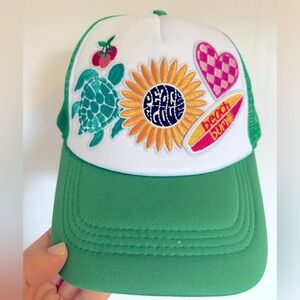 Green snapback trucker hat with patches